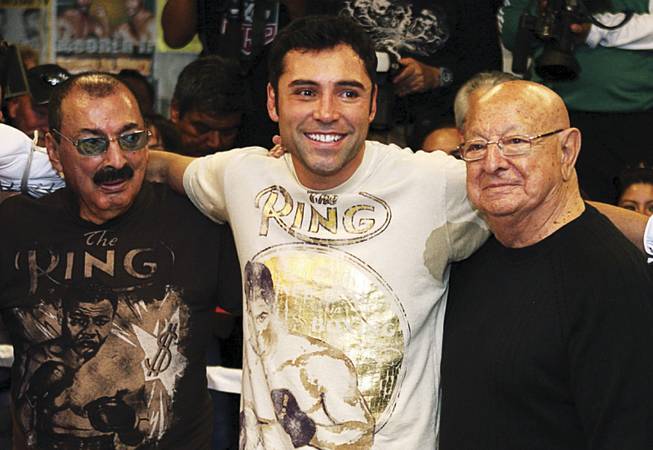De La Hoya, center, is being trained at Big Bear by Ignacio "Nacho" Beristain, left, with consulting by the legendary Angelo Dundee, right, who worked with such champions as Muhammad Ali and George Foreman. De La Hoya says Beristain has identified flaws in the his performance in the five big fights he's lost since 1999, and he's working on them.