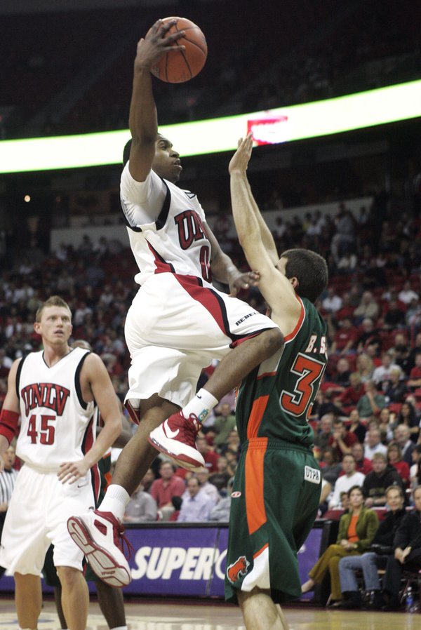 UNLV guard Oscar Bellfield rolls in a shot over the ...