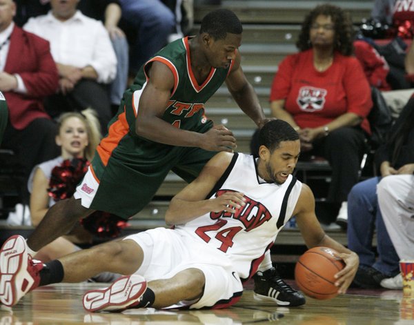 UNLV guard Rene Rougeau keeps a loose ball away from ...