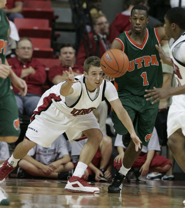 UNLV guard Scott Hoffman passes off a defensive rebound to ...
