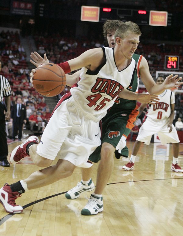 UNLV forward Joe Darger drives past Texas-Pan American guard Nick ...