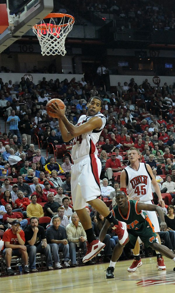 UNLV's Rene Rougeau pulls in a rebound in the first ...