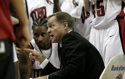 UNLV head coach Lon Kruger gives instructions during a timeout.