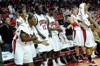 The Rebels' bench cheers on as UNLV pulls away from Texas-Pan American Tuesday night at the Thomas & Mack Center. 