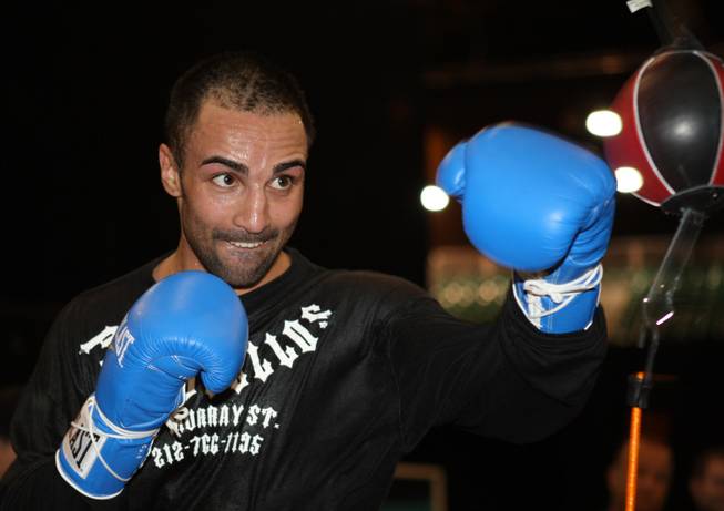 Junior welterweight boxer Paulie Malignaggi of New York hits a double-end bag during a workout at the MGM Grand Garden Arena in Las Vegas, Nevada on Tuesday, November 18, 2008.