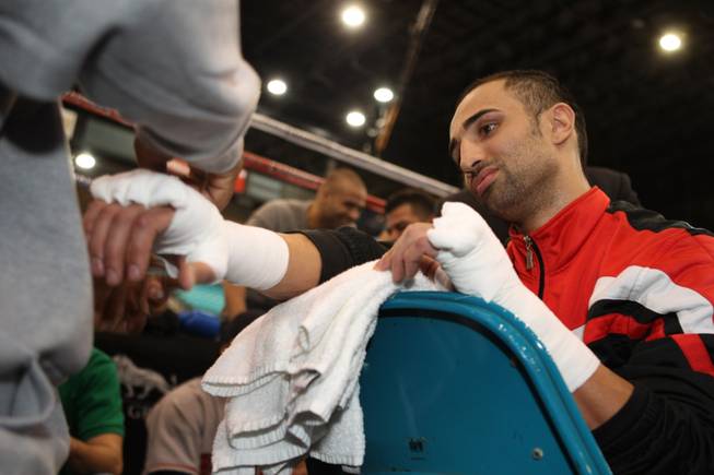 Junior welterweight boxer Paulie Malignaggi of New York has his hands taped before a workout at the MGM Grand Garden Arena in Las Vegas, Nevada on Tuesday, November 18, 2008. Malignaggi is preparing for a 12-round title fight with British boxer Ricky Hatton at the arena on Saturday.