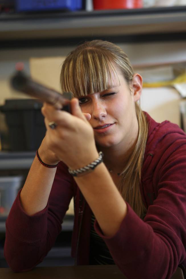 Concentrating on her paper turkey, 17-year-old Ashley Vince takes aim as she hopes to outscore her brothers Tuesday while competing in the annual Turkey Shoot at the Boulder City Recreation Center.