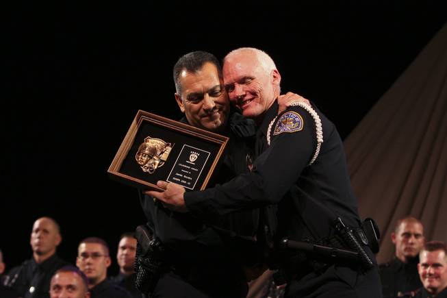 Henderson Police Officer Jamie Borden receives a congratulatory hug from Sgt. Ray Castro, left, after receiving the Leadership Award for the Class of 2008-02 during the Southern Desert Regional Police Academy commencement ceremony Nov. 13. Borden served with the Henderson Police Department in 1998 for five years and returned to the academy in 2008 at the age of 42 to follow his life-long desire of serving as an officer.