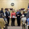 Dee Lyon holds the Community Pride Award she received from Henderson Mayor James B. Gibson, center, ad City Council members from left, Jack Clark, Steve Kirk, Gerri Schroder and Andy Hafen.