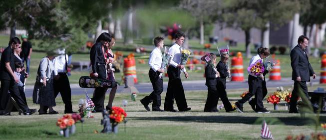 Mourners make their way to the grave of Olivia "Lynn" Brandise Hyten to say their last goodbyes Wednesday. Brandise Hyten, 15, was killed in a rollover car crash early Saturday morning. Services were held at Palm Mortuary in Green Valley.