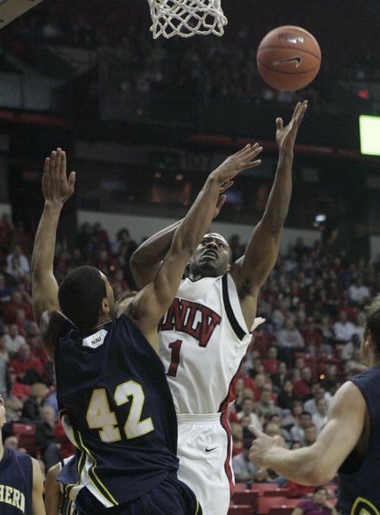 UNLV guard Wink Adams shoots over Northern Arizona center Joshua Lepley during the first half of the game Thursday.