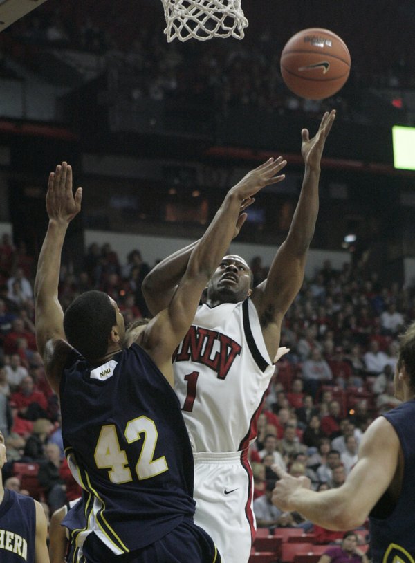 UNLV guard Wink Adams shoots over Northern Arizona center Joshua ...