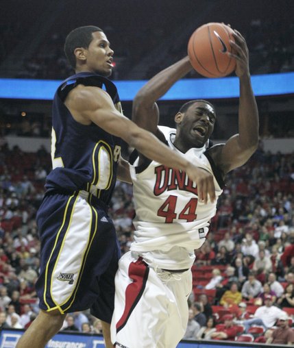 UNLV forward Darris Santee pulls an offensive rebound away from Northern Arizona center Joshua Lepley during the second half of Thursday's game.