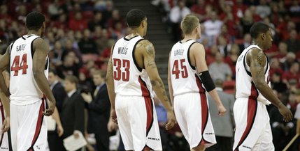 The Rebels head back onto the court after a timeout in the second half of Thursday's game.