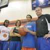 From left, Bishop Gorman junior basketball player Aaryn Ellenberg, 16, poses with her coach Sheryl Krmpoti and senior basketball player Czar Robotham, 18, stands next to his basketball coach Grant Rice.