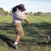 Kari Higa, 33, hits balls at the driving range at Spanish Trail Golf Course. One of the best amateur golfers in the city, Higa recently won the Spanish Trail Club Championship. 
