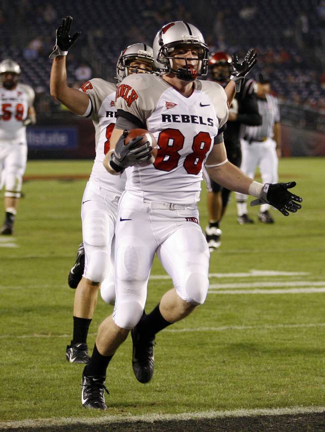 UNLV wide receiver Ryan Wolfe scores a touchdown on a pass reception during the first quarter against San Diego State.