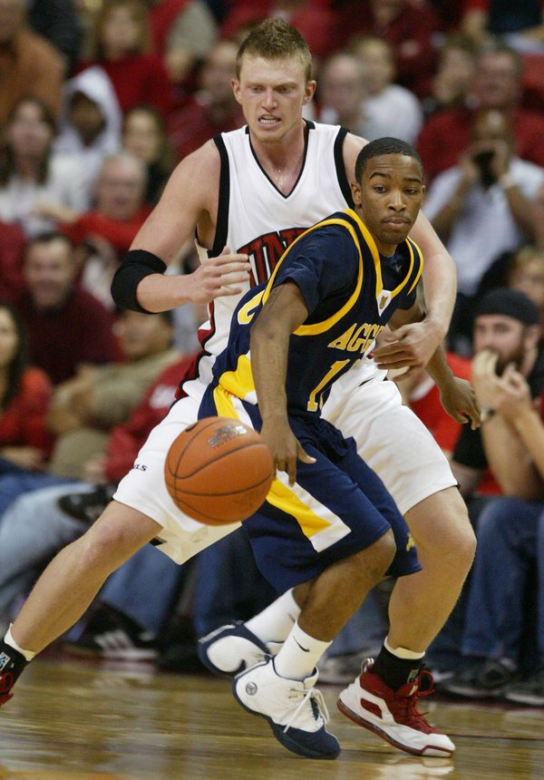 UNLV forward Joe Darger forces North Carolina A&T guard Marc ...