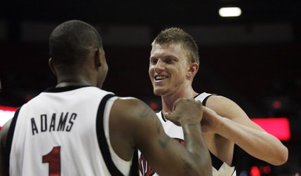UNLV guard Wink Adams and forward Joe Darger bump fists in the closing minutes of their game against North Carolina A&T Saturday at the Thomas & Mack Center. UNLV won 71-58 and improved to 4-0. Adams had a game-high 19 points while Darger finished close behind with 18. 