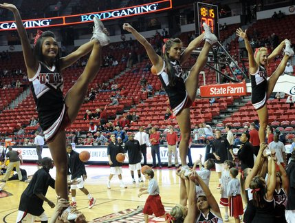 Cheerleaders get the crowd ready for UNLV's game with North Carolina A&T at the Thomas & Mack Center on Saturday night. 