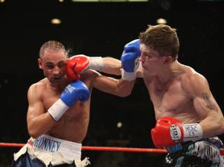 Ricky Hatton (right) of Britain connects with Paulie Malignaggi of the U.S. during a junior welterweight bout at the MGM Grand Garden Arena in Las Vegas. Hatton won by TKO in the 11th round.