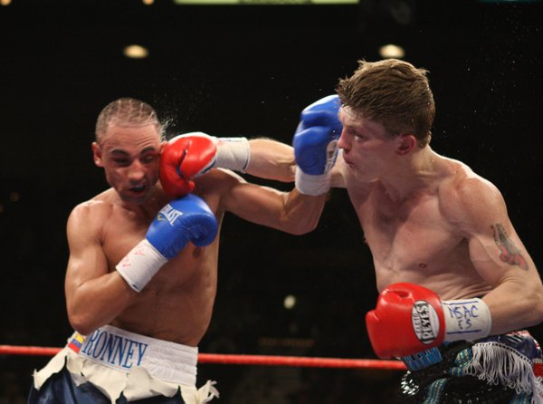 Ricky Hatton (right) of Britain connects with Paulie Malignaggi of ...