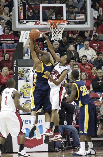 UNLV contests the North Carolina A&T shot in the first half of the game Saturday night.