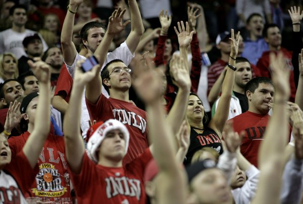 UNLV fans put their hands up during a free throw ...