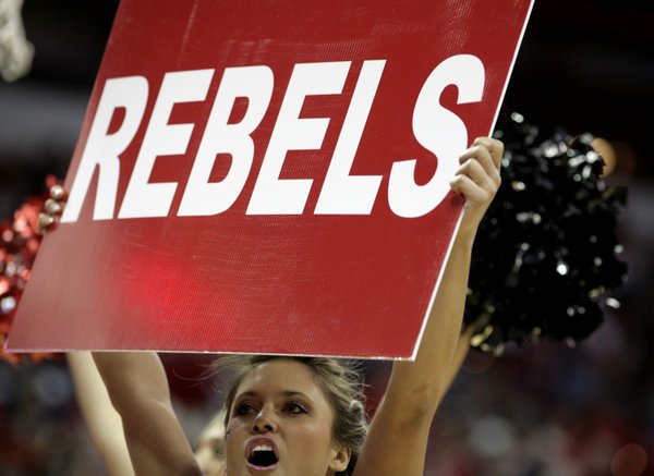 The Rebel cheerleaders get the crowd going during a timeout ...