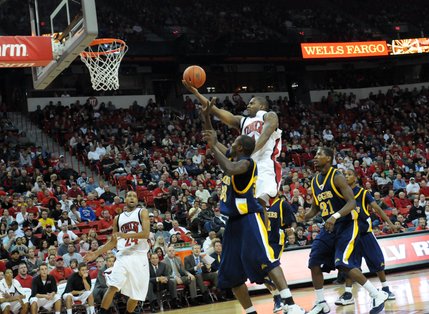 Wink Adams rises above the defense to lay it in for two.  He ended the game with 19 points.