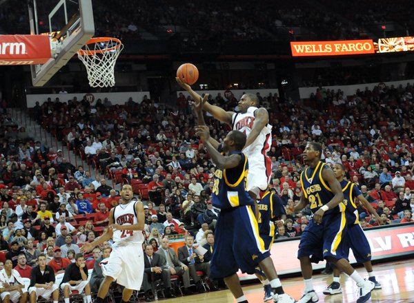 Wink Adams rises above the defense to lay it in ...