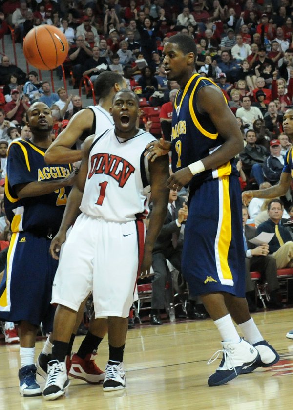 UNLV's Wink Adams reacts after he scores two of his ...