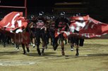 The Las Vegas Wildcats bust through the banner at the end of halftime during the Sunrise Regional championship game against Del Sol at Frank Nails Field with a 25-38 win on Friday.