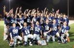 The Meadows football team celebrates its 2A state title with a 46-30 win against Pershing County at Arbor View High School on Saturday.
