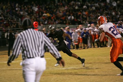 Palo Verde's Torin Harris (5) runs the ball against Bishop Gorman during the Sunset Regional championship game at Palo Verde Friday.
