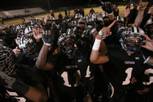 Palo Verde players celebrate their 50-14 Sunset Regional championship victory over Bishop Gorman.
