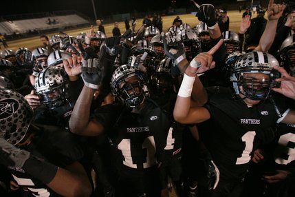 Palo Verde players celebrate their 50-14 Sunset Regional championship victory over Bishop Gorman.