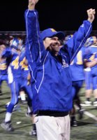 Moapa Valley coach Brent Lewis celebrates the Pirates' 3A championship over Truckee on Saturday night.