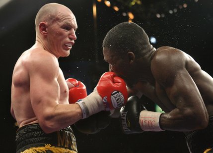 Matthew Hatton, the younger brother of Ricky Hatton, delivers a blow to Ben Tackie in their welterweight bout Saturday night at the MGM Grand Garden Arena.