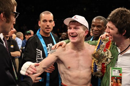 Ricky Hatton, of Britain, celebrates with musicians Liam (left) and Noel Gallagher after defeating Paulie Malignaggi of the U.S. in a junior welterweight title bout at the MGM Grand Garden Arena in Las Vegas. Hatton won by TKO in the 11th round.