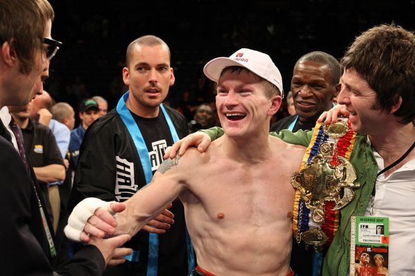 Ricky Hatton, of Britain, celebrates with musicians Liam (left) and ...