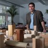 Robert Dorgan looks out over a wooden model of downtown Las Vegas at the Downtown Design Center, a c