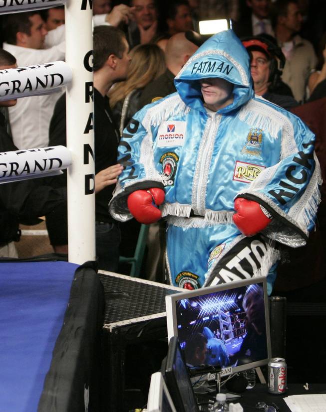 Hatton makes his way to the ring in a fat suit, a self-deprecating joke that Mayweather Sr. discouraged.