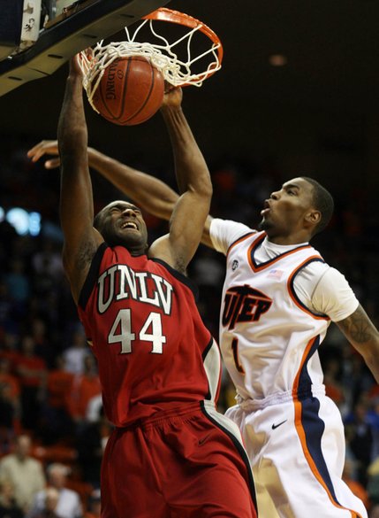 UNLV's Darris Santee, left, slam dunks over UTEP's Arnett Moultrie during the first half Monday in El Paso, Texas.