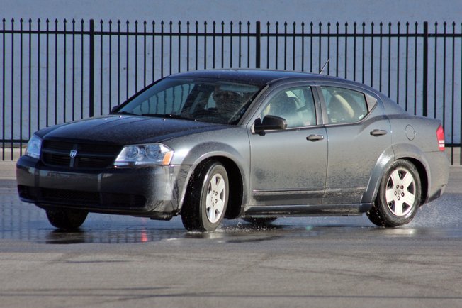 Students who participate in the Driver's Edge program use special practice cars to practice steering and control while skidding.