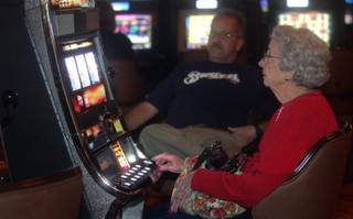 Hotel guest Lorraine Hosking gambles at one of Silverton's 800 new slot machines on Thursday.