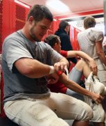 Las Vegas High School senior offensive lineman Madison Hales suits up for practice Wednesday in preparation for Saturday's state semifinal game against Palo Verde.