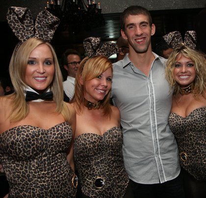 Michael Phelps and Playboy bunnies, shown during Phelps' visit to the Playboy Club in September.