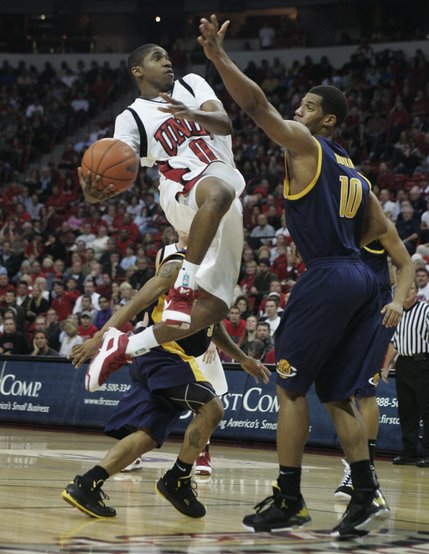 UNLV guard Oscar Bellfield drives past Cal forward Jamal Boykin during the second half of their game Friday at the Thomas & Mack Center. UNLV lost the game 73-55. 