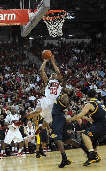 Tre'Von Willis of UNLV lays it in over the California defense Friday at the Thomas & Mack Center.